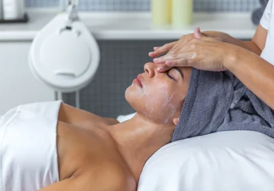 side-view-of-a-beautician-applying-cream-on-face-o-2025-03-07-20-49-22-utc